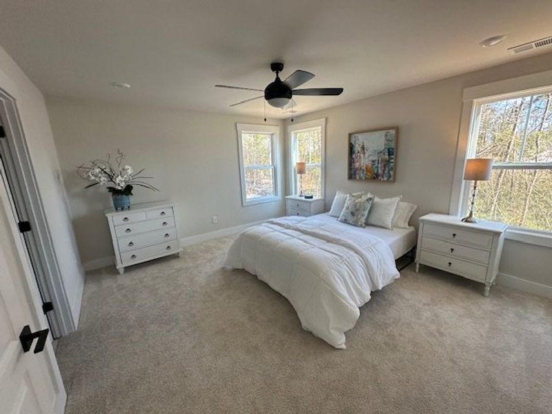 This airy bedroom offers a peaceful retreat with a