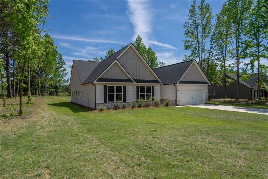 Front exterior of a new home in , Good Hope, GA, highlighting curb appeal (Image 27). Front exterior of a new home in , Good Hope, GA, highlighting curb appeal (Image 27).
