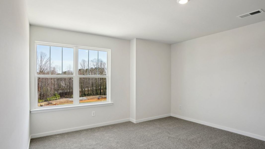 Spacious, unfurnished interior of a new home in Tap Root Farms, Fletcher (Image 19).