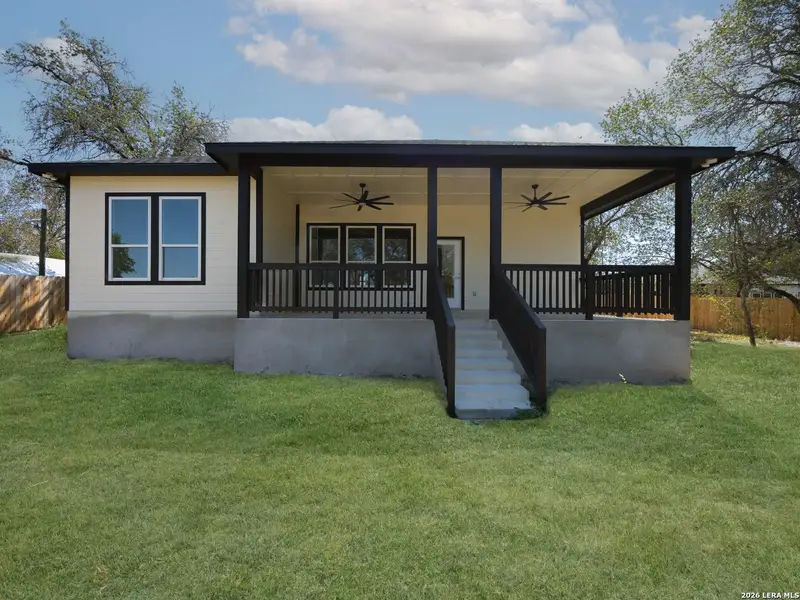 Exterior details and patio area of a home in , Elmendorf (Image 3).