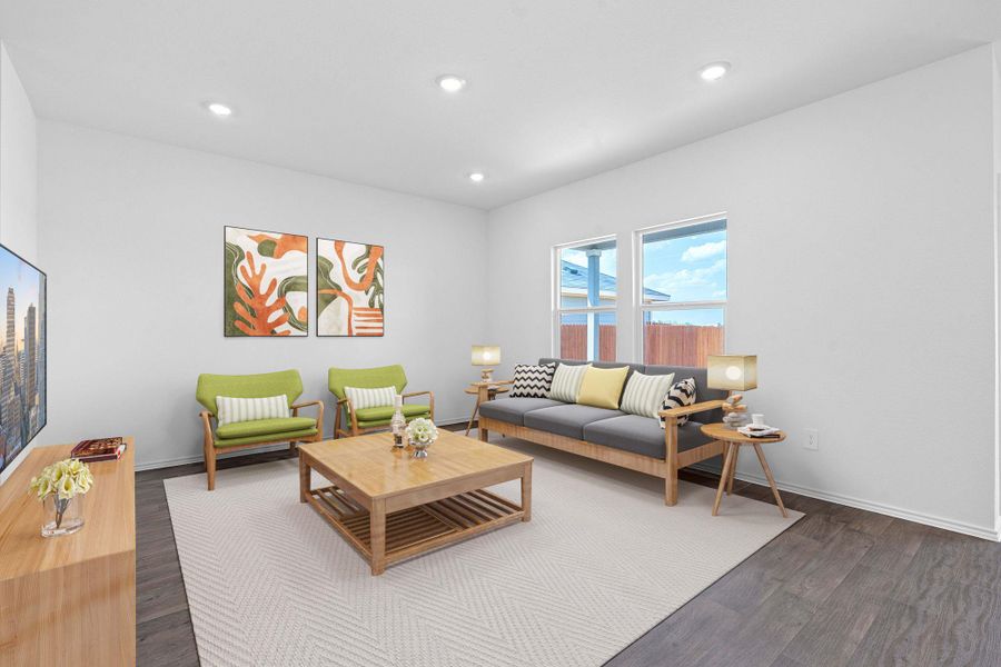 Living area featuring dark wood-style flooring and recessed lighting Living area featuring dark wood-style flooring and recessed lighting