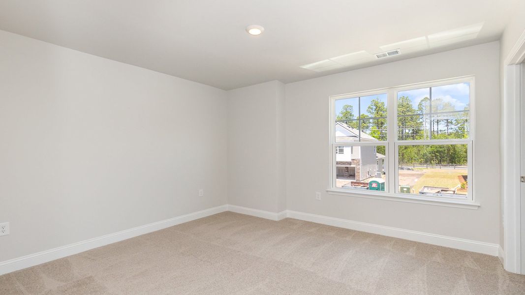 Representative unfurnished interior of a home built from the Belfort by D.R. Horton in The Preserve at Shaftesbury Glen, Conway (Image 11).