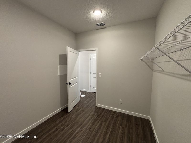 Spacious, unfurnished interior of a new home in The Cypress Series at Reserve East, Flagler Beach (Image 28).