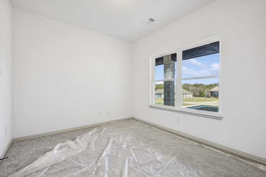 View of carpeted spare room