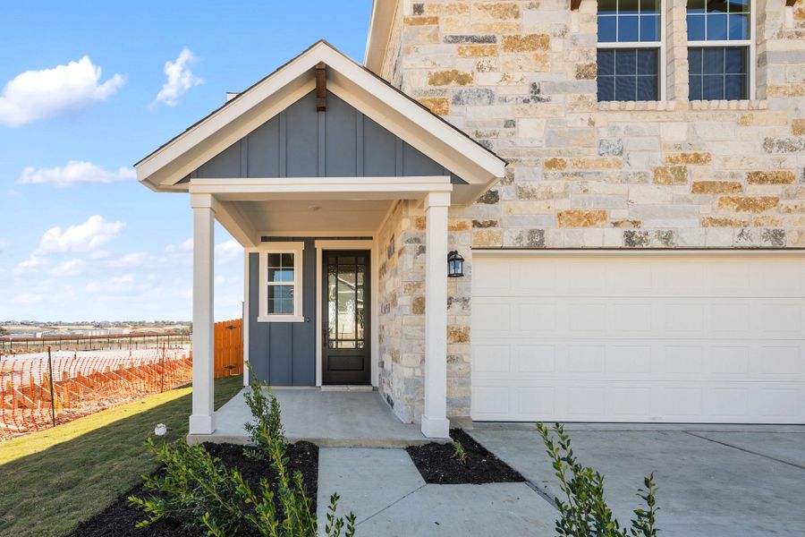 Exterior details and patio area of a home in The Homestead at Lariat, Liberty Hill (Image 3).