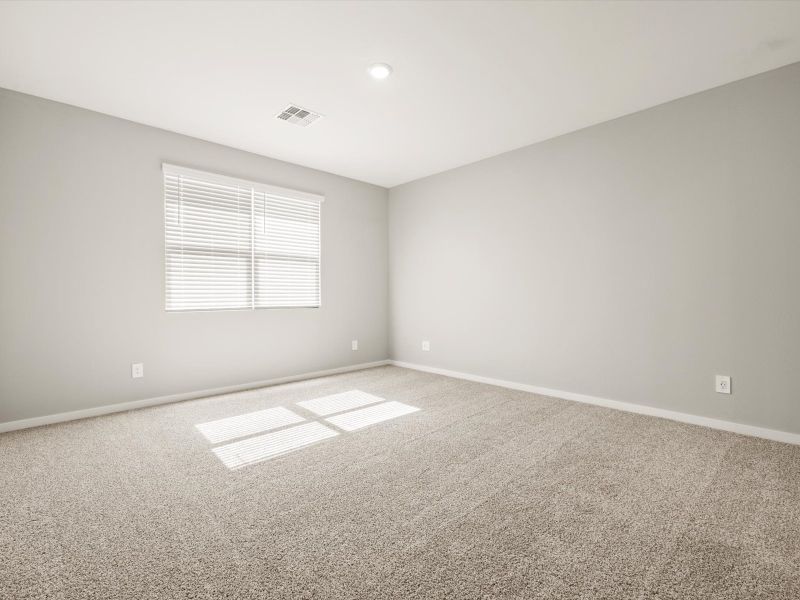Spacious, unfurnished interior of a new home in Blossom Rock Reserve Series, Apache Junction (Image 14).