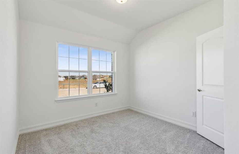 Secondary bedroom with ample closet space *real home pictured