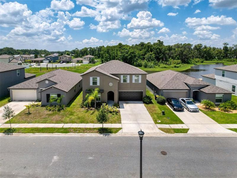 Front exterior of a new home in , Lakeland, FL, highlighting curb appeal (Image 2).