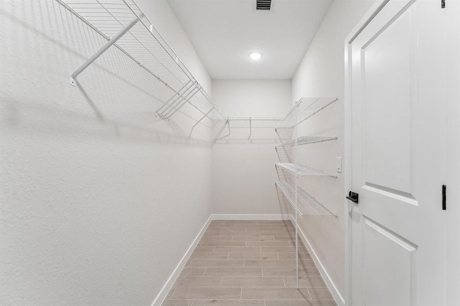 Primary Walk-in Closet Primary Walk-in Closet