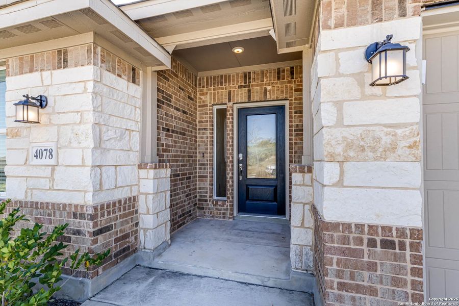 Exterior details and patio area of a home in Johnson Ranch: Brookstone II Collection, Bulverde (Image 27).