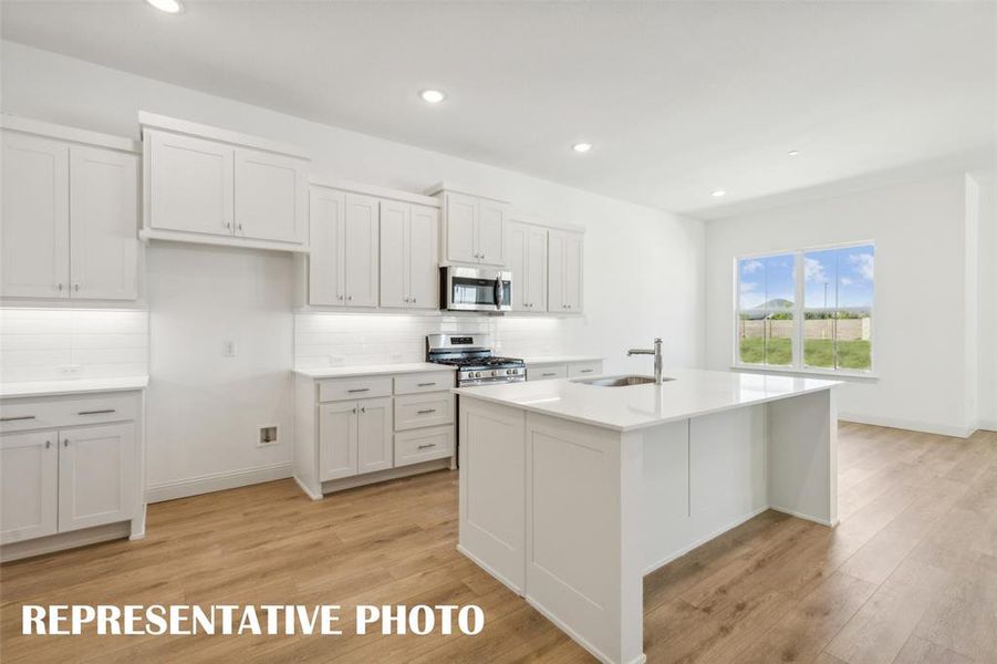 No shortage of space or style is this dream kitchen!  REPRESENTATIVE PHOTO