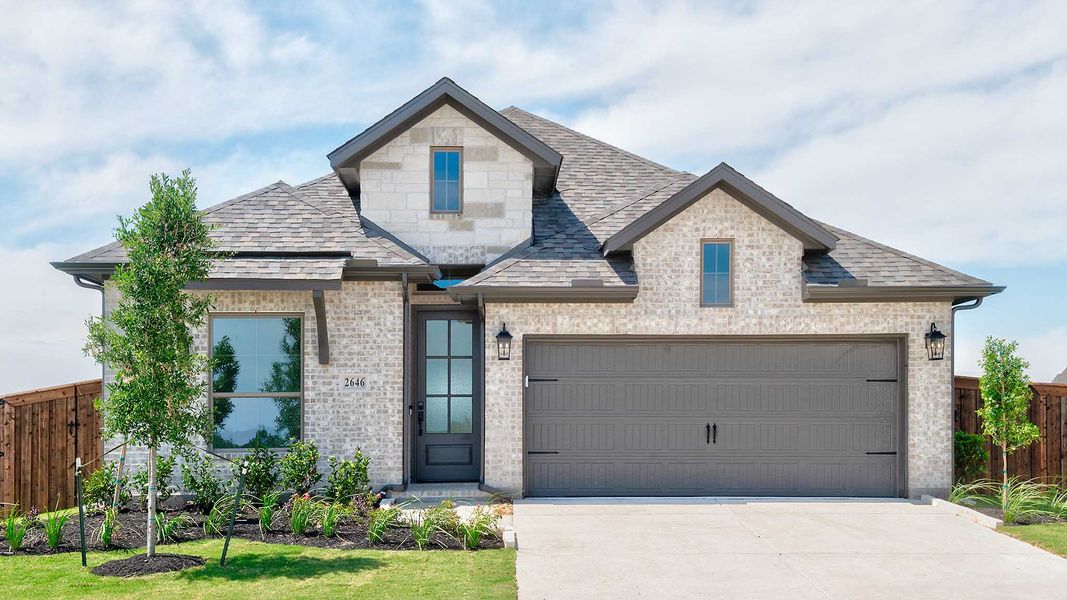 Front exterior of a new home in Meraki, Forney, TX, highlighting curb appeal (Image 1). Front exterior of a new home in Meraki, Forney, TX, highlighting curb appeal (Image 1).