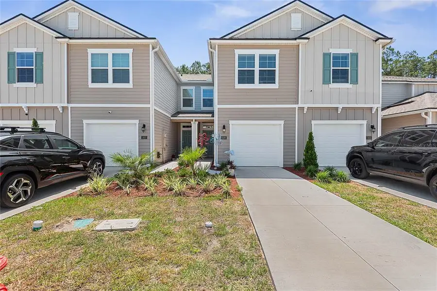Front exterior of a new home in , Palm Coast, FL, highlighting curb appeal (Image 2). Front exterior of a new home in , Palm Coast, FL, highlighting curb appeal (Image 2).