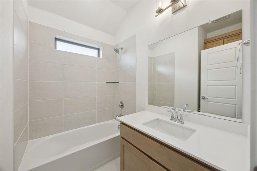 Bathroom in the Monet II home plan by Trophy Signature Homes – REPRESENTATIVE PHOTO