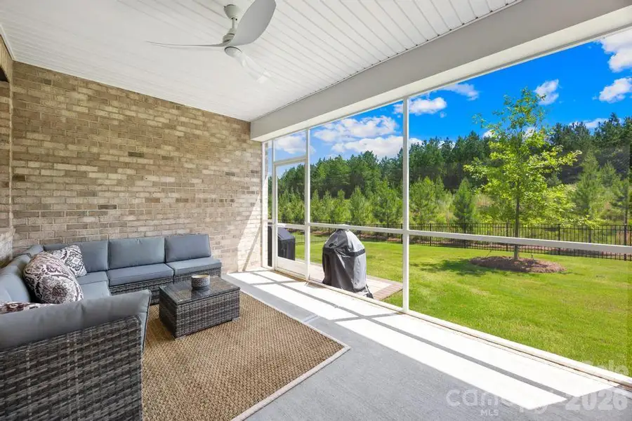 Screened back porch. Sellers added BBQ patio in backyard with pavers and fenced backyard