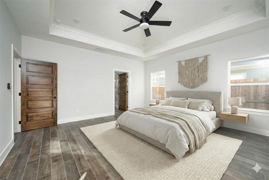 Virtually generated decoration Bedroom featuring wood finish floors, ornamental molding, ceiling fan, and a raised ceiling