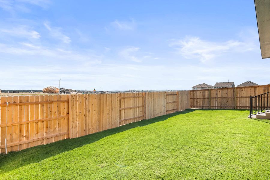 Exterior details and patio area of a home in Lariat, Liberty Hill (Image 26).