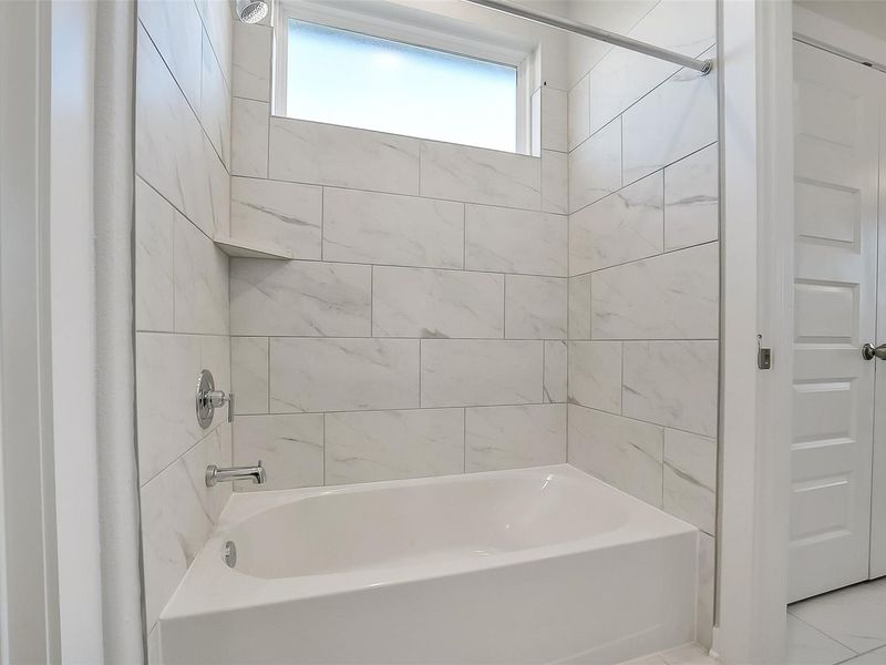 Furnished interior view inside a new home in Sunterra, Katy (Image 18).