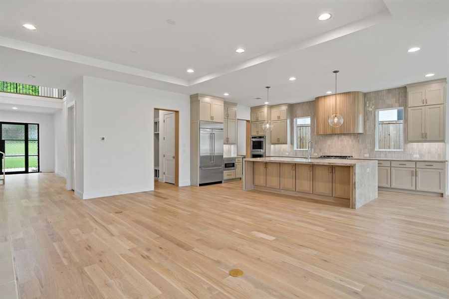 A look toward the entry from the living room that offers a glimpse of the mud room leading to the attached garage.