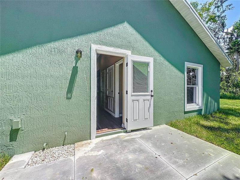 Front exterior of a new home in , Lake Panasoffkee, FL, highlighting curb appeal (Image 1).