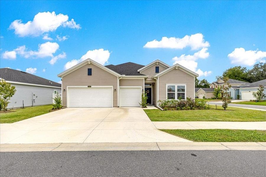 Front exterior of a new home in Millwood, Ocala, FL, highlighting curb appeal (Image 22). Front exterior of a new home in Millwood, Ocala, FL, highlighting curb appeal (Image 22).