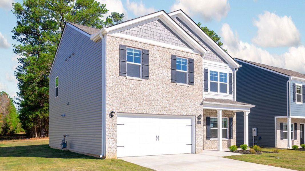 Front exterior of a new home in Hillcrest Landing, McDonald, TN, highlighting curb appeal (Image 2).