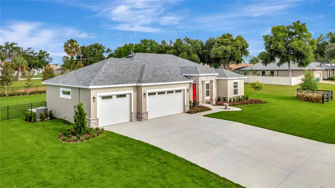 Front exterior of a new home in , Montverde, FL, highlighting curb appeal (Image 20). Front exterior of a new home in , Montverde, FL, highlighting curb appeal (Image 20).