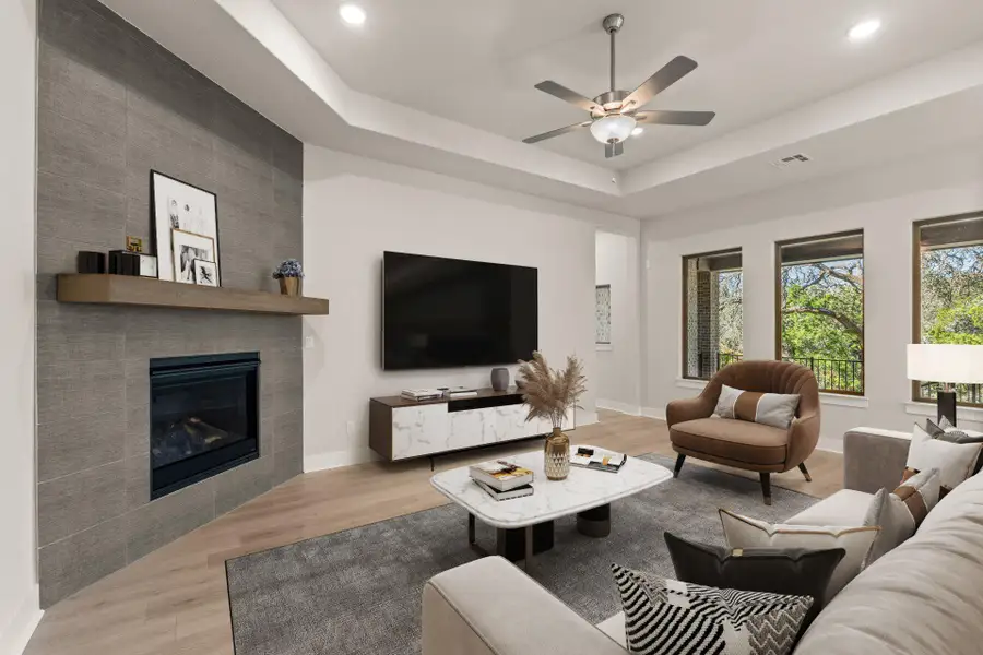 Family Room with tray ceiling & fireplace - Representative Photo