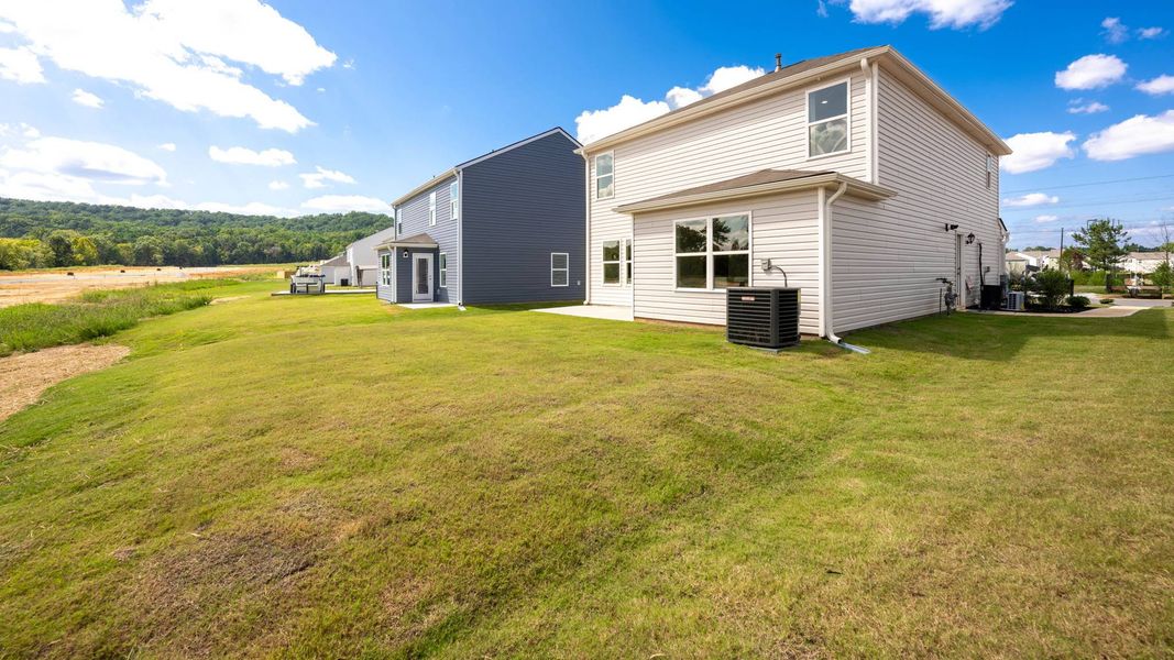 Representative exterior photo of a completed home built from the Darwin by D.R. Horton in Evergreen Landing, Rossville, GA (Image 24).