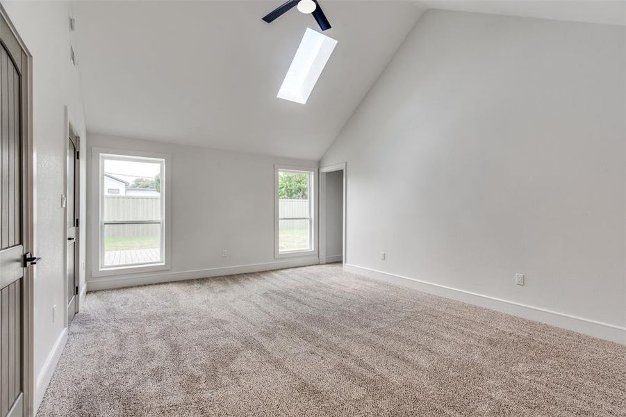 Another view of the primary bedroom which faces the very private back yard and huge deck.  The bedroom has a massive footprint , vaulted ceilings before you walk back into the owner's closet with enough storage for a small army!