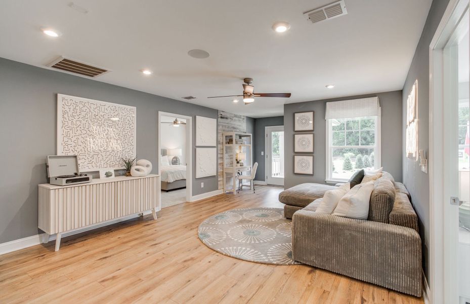 Multi-purpose loft area acts as an entertainers delight or lounge space.