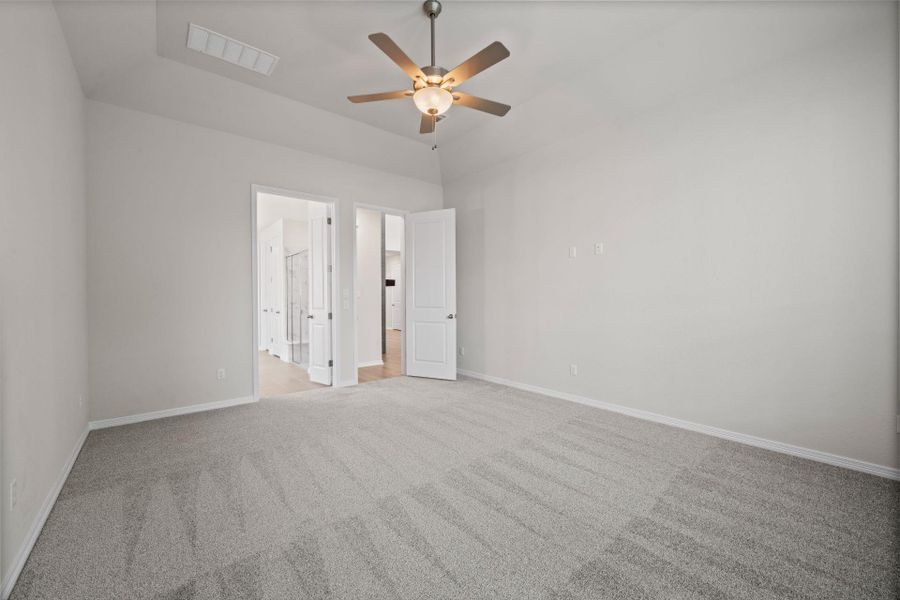 Primary Bedroom with elevated ceiling