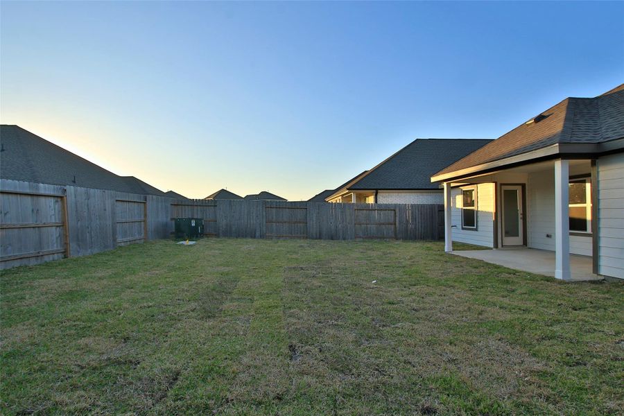 Exterior details and patio area of a home in Sunterra, Katy (Image 3). Exterior details and patio area of a home in Sunterra, Katy (Image 3).