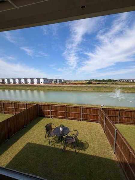 Private fenced yard featuring a manicured lawn Private fenced yard featuring a manicured lawn