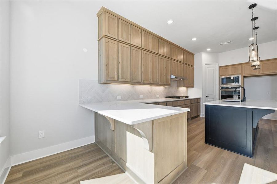 Furnished interior view inside a new home in Wildridge, Oak Point (Image 8).