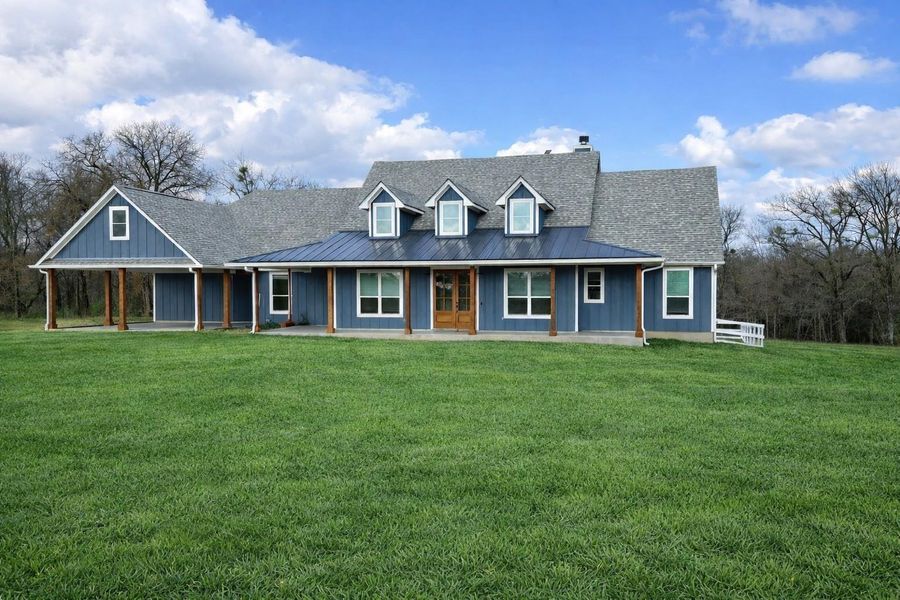 View of front of home with covered porch, a chimney, a front yard, and roof with shingles View of front of home with covered porch, a chimney, a front yard, and roof with shingles