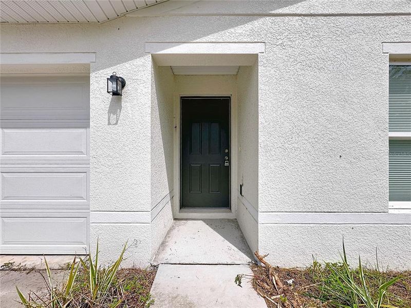 Front exterior of a new home in , Crescent City, FL, highlighting curb appeal (Image 17).