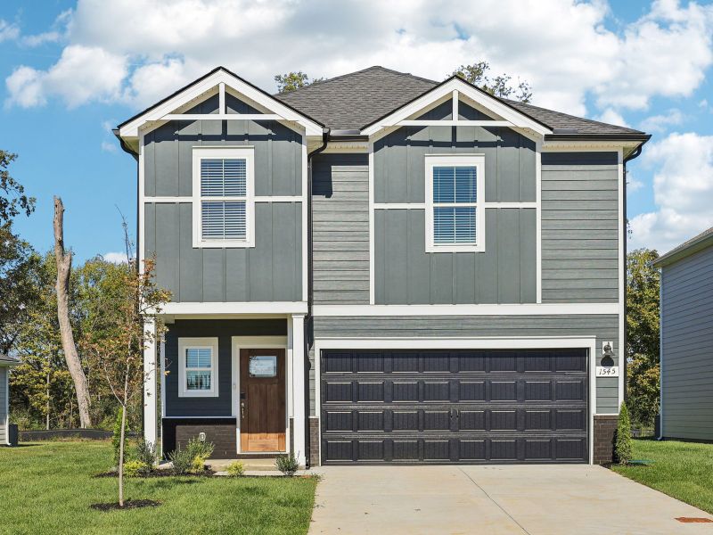 Front exterior of a new home in Bear Springs, Columbia, TN, highlighting curb appeal (Image 1).