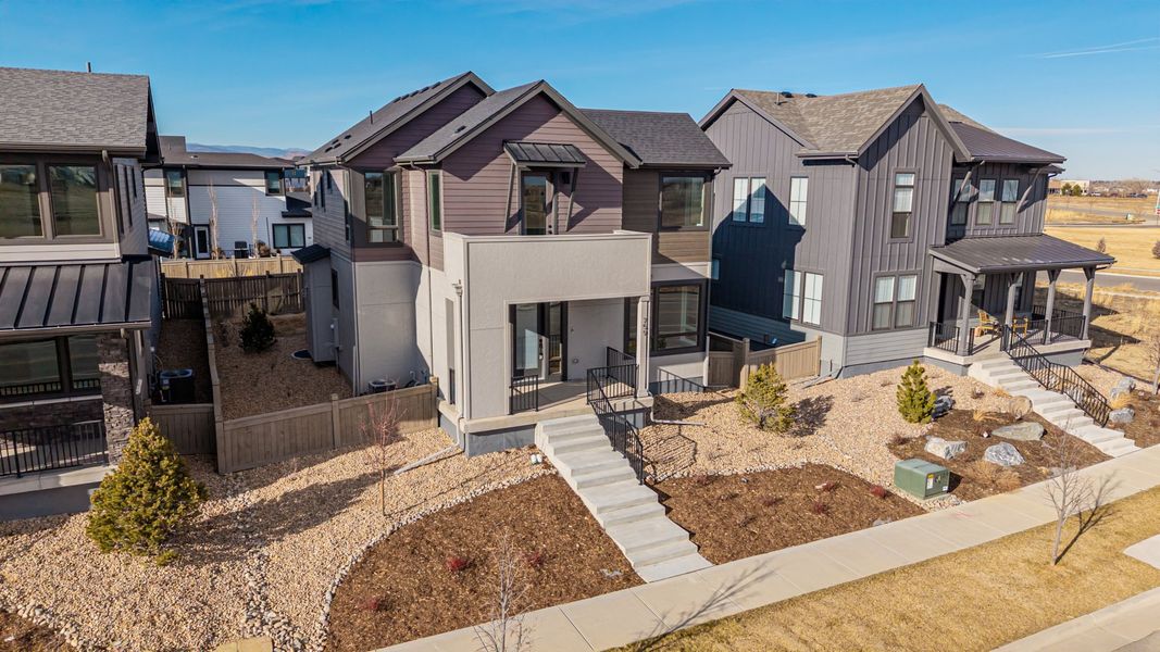 Front exterior of a new home in West Grange, Longmont, CO, highlighting curb appeal (Image 23).