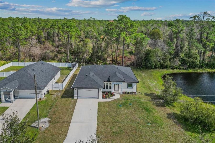 Front exterior of a new home in , Deltona, FL, highlighting curb appeal (Image 21).