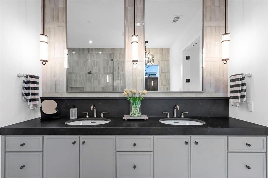 Full bathroom with tasteful backsplash and double vanity Full bathroom with tasteful backsplash and double vanity