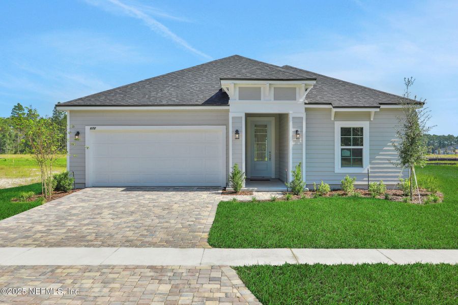 Front exterior of a new home in Brook Forest - Single Family Homes, St. Augustine, FL, highlighting curb appeal (Image 1). Front exterior of a new home in Brook Forest - Single Family Homes, St. Augustine, FL, highlighting curb appeal (Image 1).