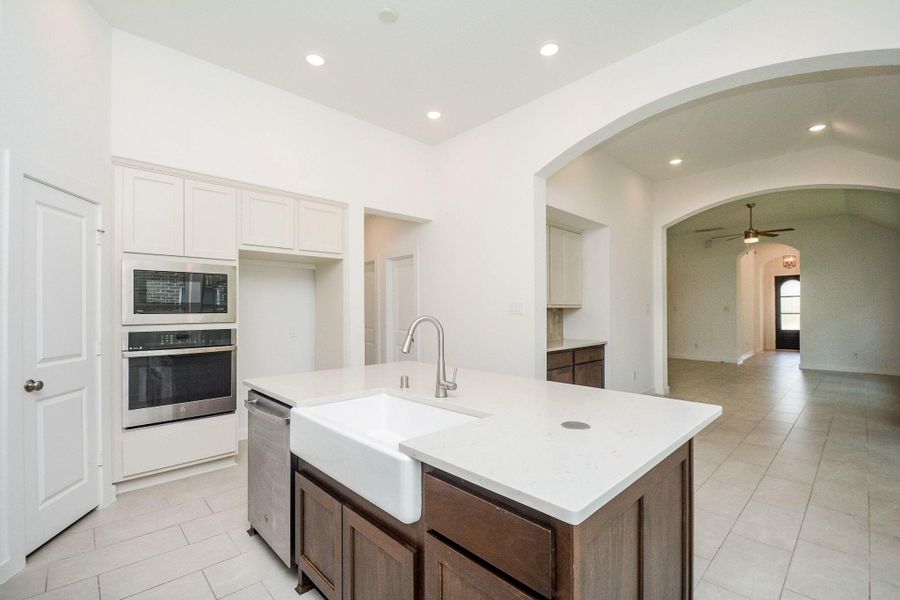 Chef inspired kitchen with quartz countertops and designer finishes. Chef inspired kitchen with quartz countertops and designer finishes.
