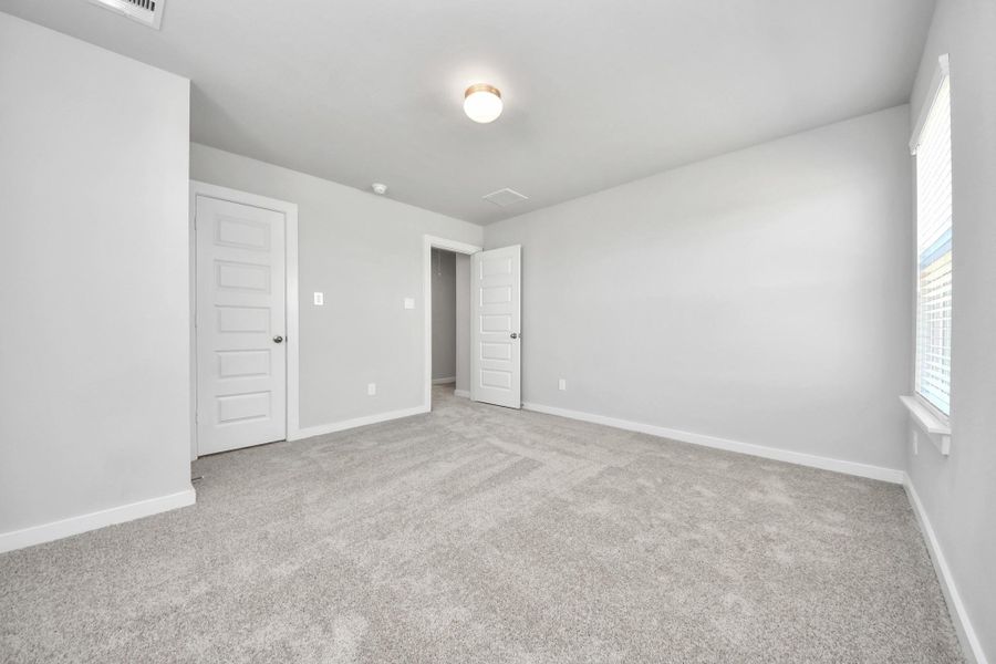 Generously sized secondary bedrooms featuring spacious closets, soft and inviting carpeting underfoot, large windows allowing plenty of natural light, and the added touch of privacy blinds for your personal retreat. Sample photo of completed home with similar floor plan. Actual colors and selections may vary. Generously sized secondary bedrooms featuring spacious closets, soft and inviting carpeting underfoot, large windows allowing plenty of natural light, and the added touch of privacy blinds for your personal retreat. Sample photo of completed home with similar floor plan. Actual colors and selections may vary.