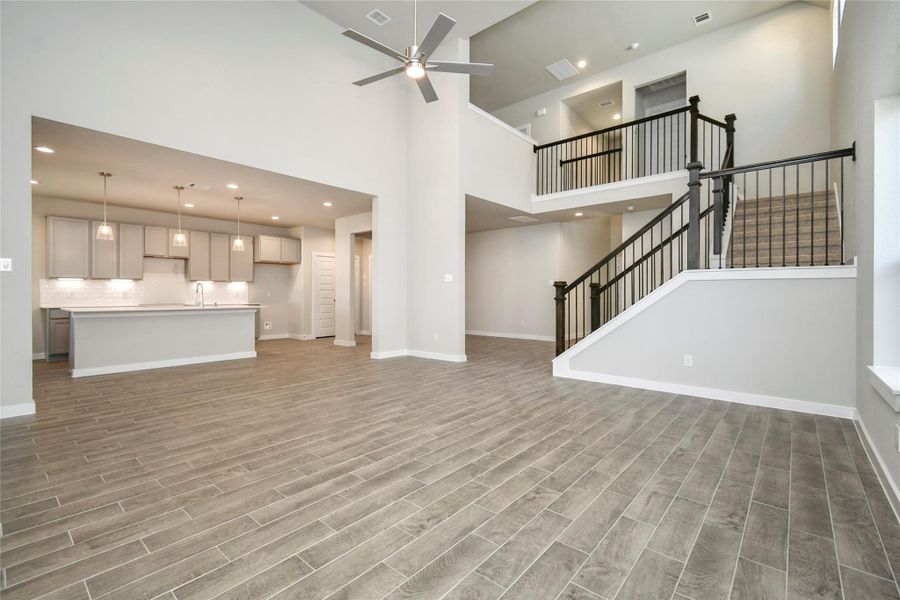 Discover another perspective of the expansive family room! Sample photo of completed home with similar floor plan. Actual colors and selections may vary.