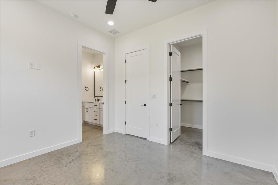 Bedroom 4 with walk in closet, ceiling fan, connected bathroom, and recessed lighting Bedroom 4 with walk in closet, ceiling fan, connected bathroom, and recessed lighting