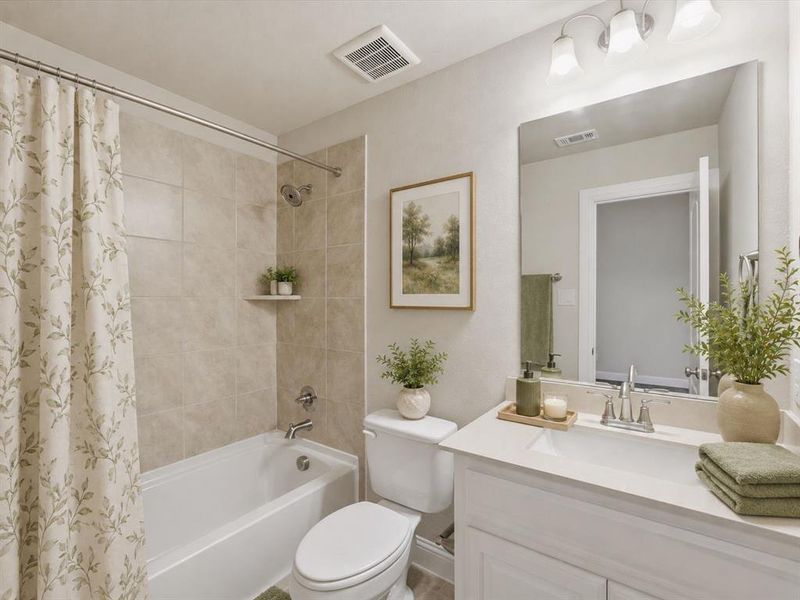 Full bathroom featuring a white tub, shower with light-toned wall tiling, white vanity with integrated sink, and an overhead vanity light fixture Full bathroom featuring a white tub, shower with light-toned wall tiling, white vanity with integrated sink, and an overhead vanity light fixture