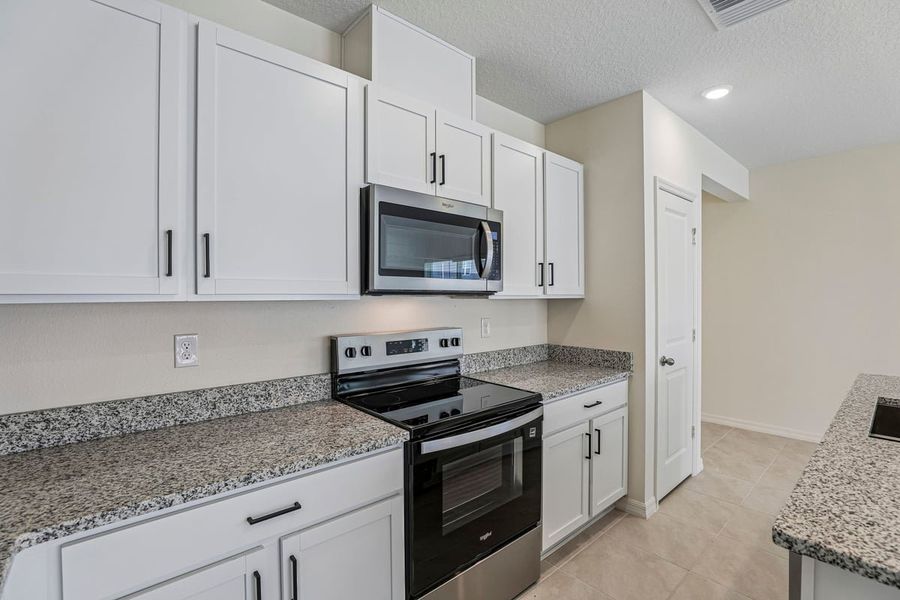 Furnished interior view inside a new home in Reserve at Forest Lake Townhomes, Lake Wales (Image 7).