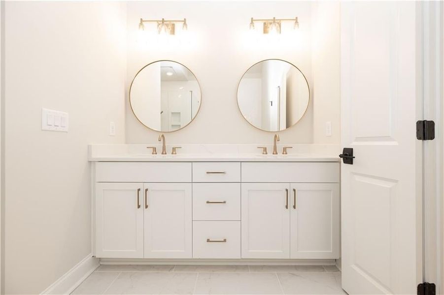 Image of previously built Chamberlain plan - Primary bathroom tall vanity with quartz top.