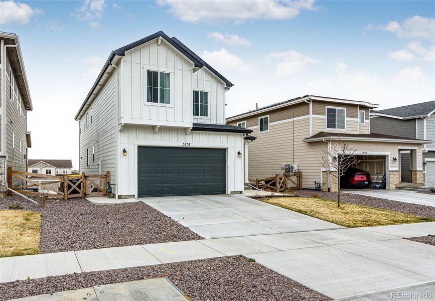 Front exterior of a new home in , Colorado Springs, CO, highlighting curb appeal (Image 24).